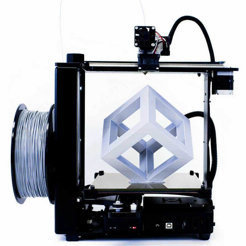 3D printer in operation with a geometric object on a white background