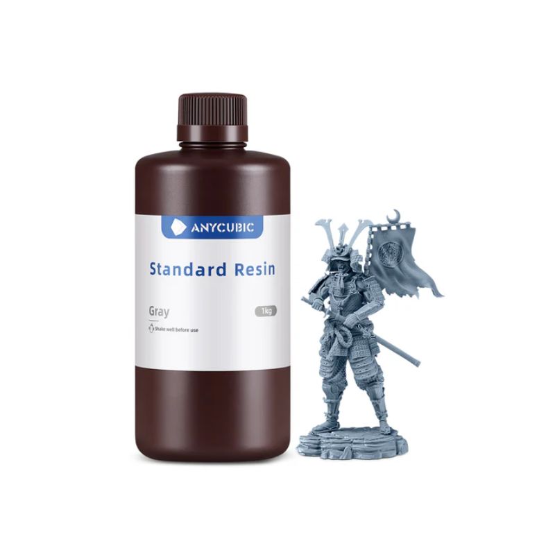 Anycubic Standard Resin bottle with a gray 3D printed figurine on a white background