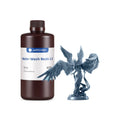 Anycubic water-wash resin bottle with a gray resin sculpture on a white background